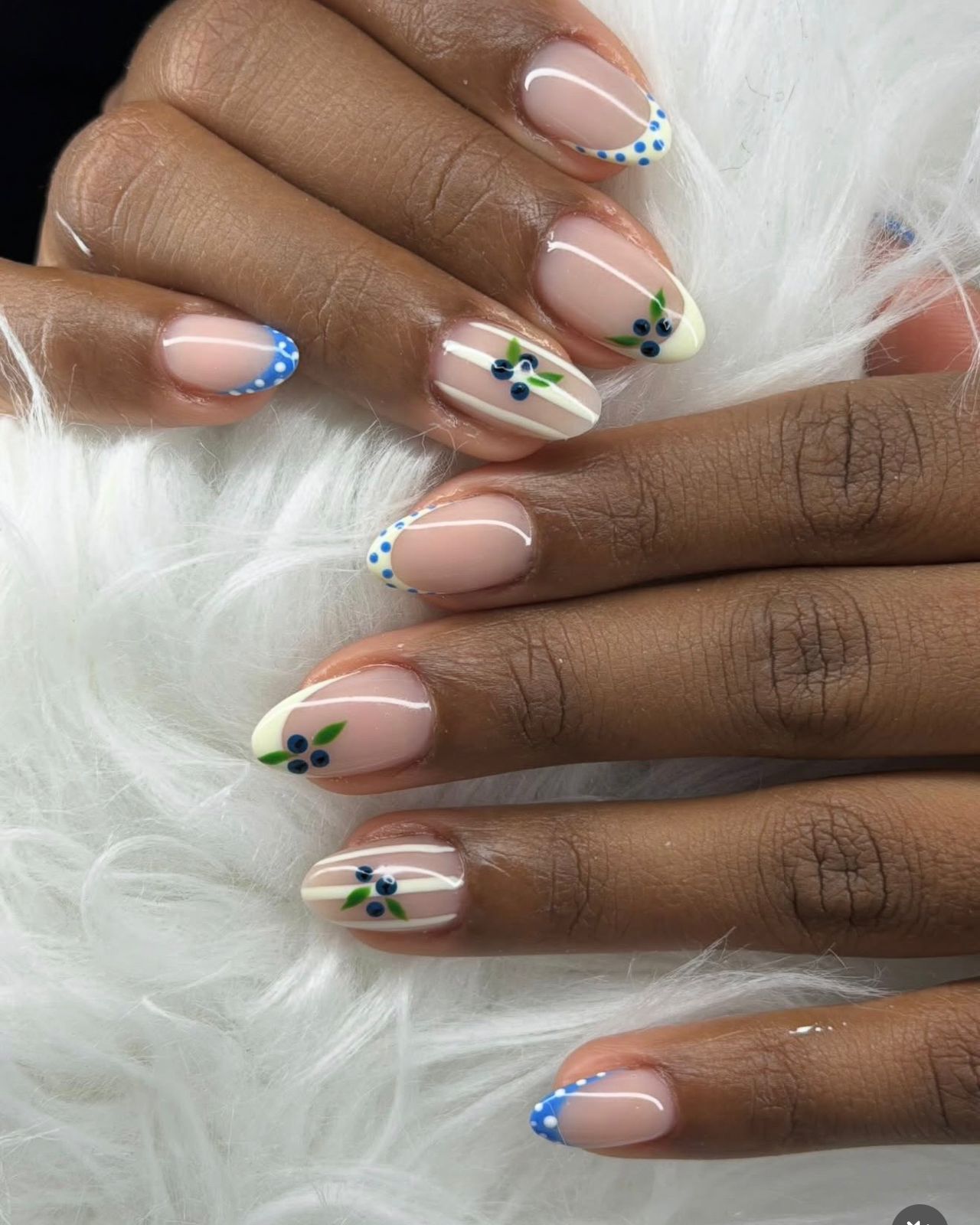 Nude nails with blueberry floral art