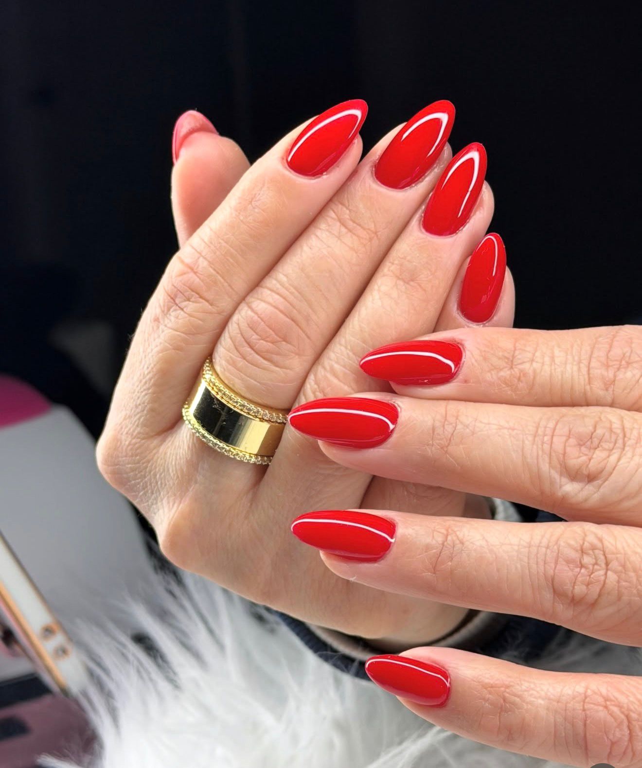 Glossy red almond gel manicure